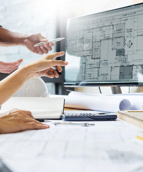 Architects looking a house plans on computer