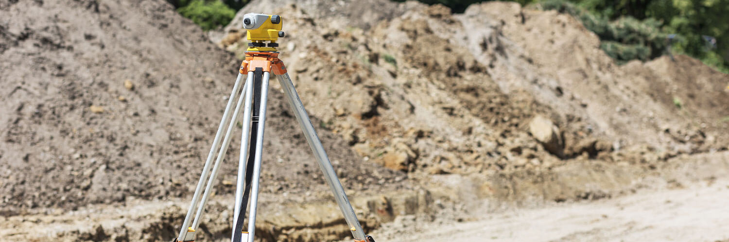 Land surveyor set up on site