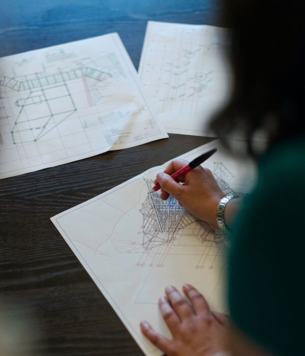 Female architect evaluating plans